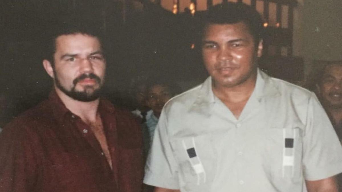 Greg Gorrell poses for a photo with Muhammad Ali.