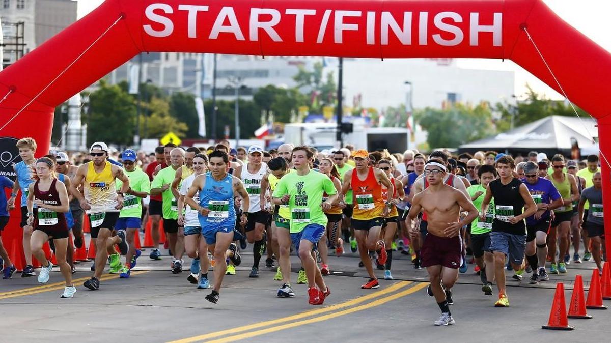Runners take off in the River Run 10K run Saturday morning by the Boathouse in downtown Wichita.