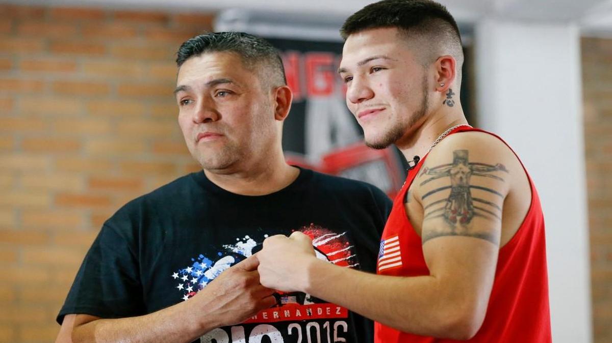 Lewis Hernandez poses with Nico before his son competed in the 2016 Olympics in Brazil. Lewis briefly contemplated leaving boxing altogether in 2011.