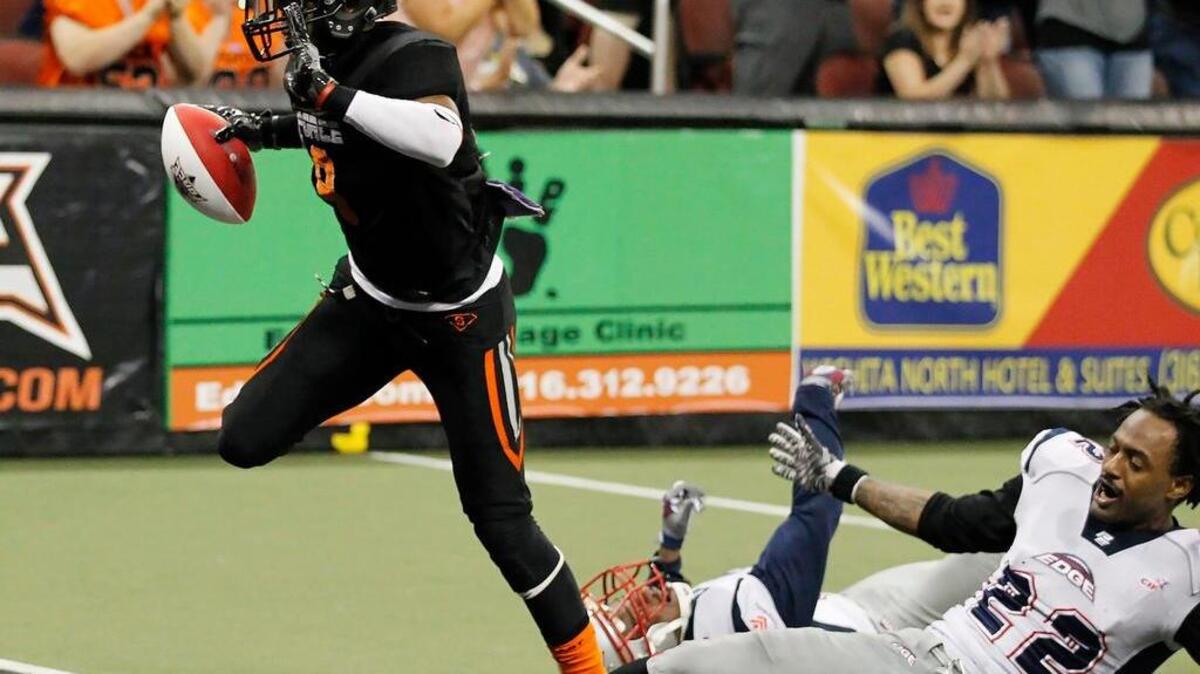 The Force’s Clarence Anderson scores a touchdown against Bloomington’s Dominic Mcuffie on June 18 at Intrust Bank Arena.