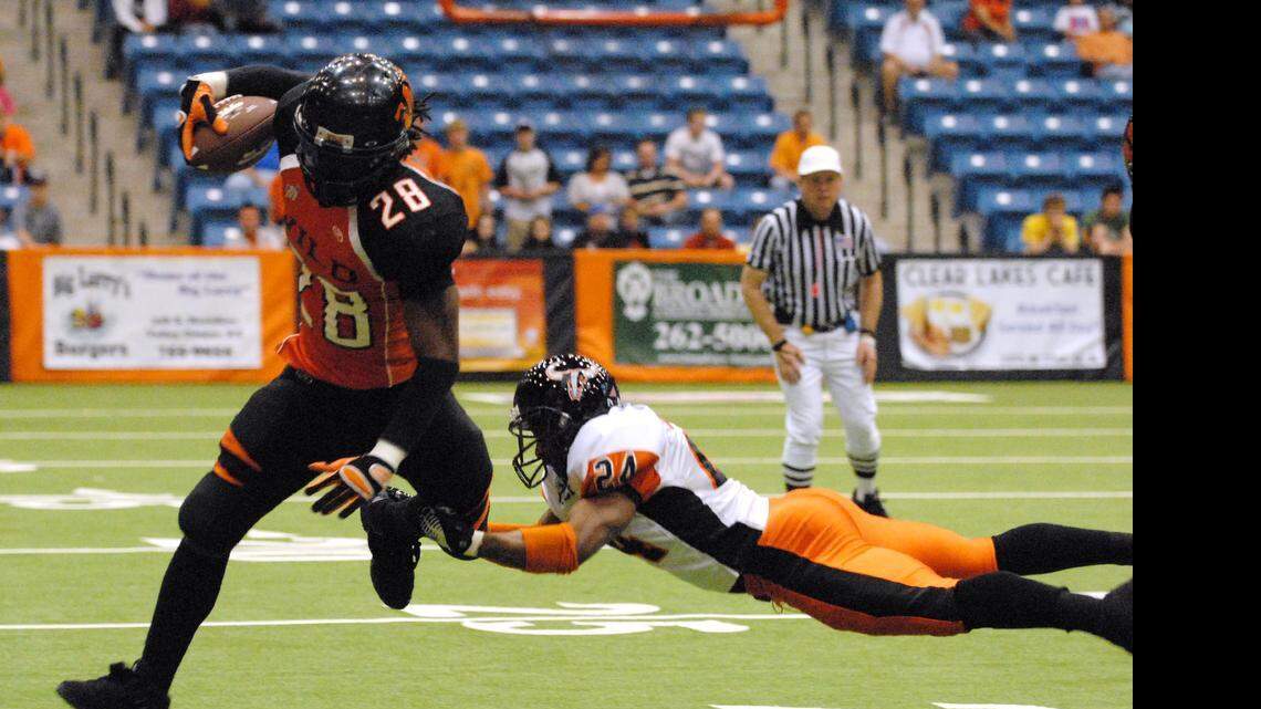 
Wichita's Darius Fudge tries to leap past a tackle in a game from April 10, 2010.
