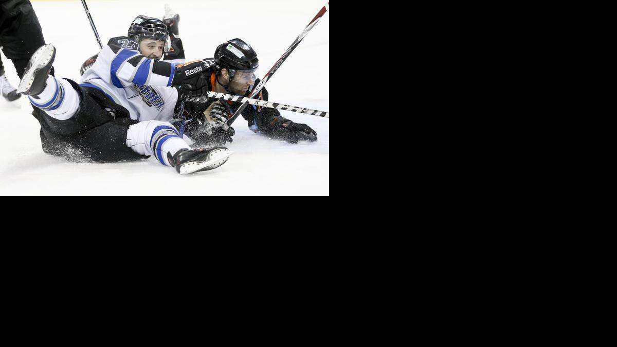
The Thunder's Alex Bourret, left, and Missouri's Martin Lee collide in front of the Missouri goal in the third period at Intrust Bank Arena on Saturday night.
