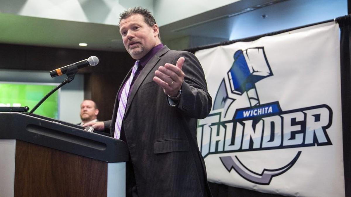 New Thunder coach Malcolm Cameron speaks Friday in front of the team’s new logo.
