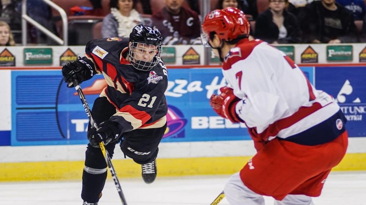 The Thunder’s Matt DeBlouw (21) attempts a shot against Allen defenseman Eric Roy in Sunday’s first period at Intrust Bank Arena.