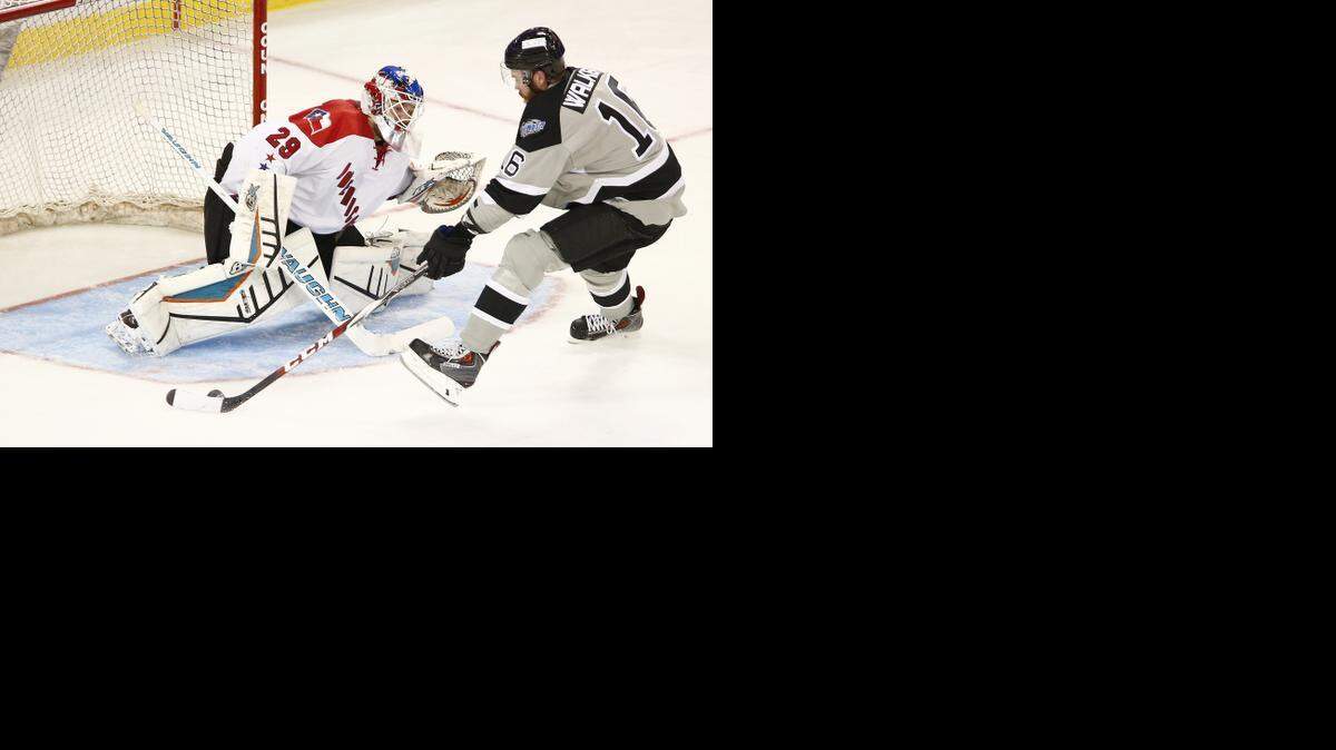 
Thunder forward Jared Walker, right, closes in for a shot against Allen goalie Aaron Dell in the second period Saturday at Intrust Bank Arena.

