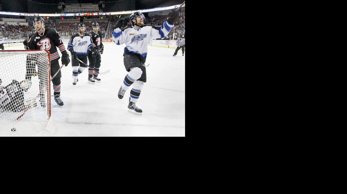 
The Thunder's Eric Meland, right, celebrates after scoring the team's second goal against Rapid City in the first period Saturday.
