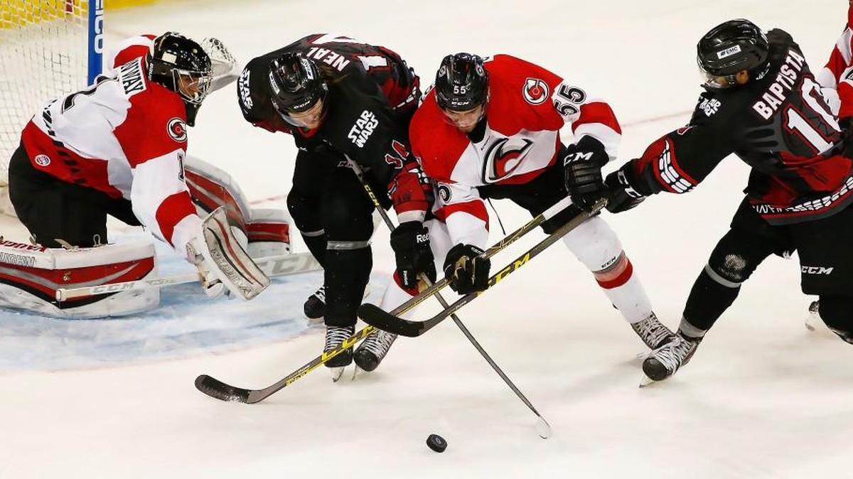 The Thunder’s Michael Neal, second from left, and Mason Baptista, right, double team Cincinnati's Ben Schmidt as they try to score in the second period Sunday night. Wichita has 54 goals; no other ECHL team has less than 70.