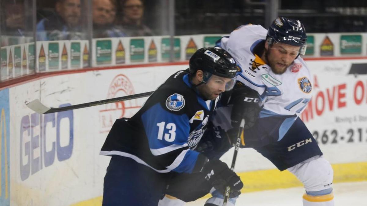 The Thunder’s Ian Lowe, left, fights for the puck during a game against Toledo in February. Wichita ended the season with the ECHL’s second-worst record, and on Tuesday announced it has changed NHL affiliations.