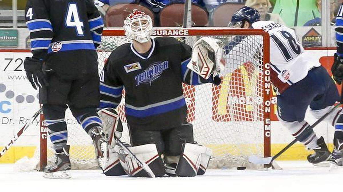 
Thunder goalie Grant Rolheiser looks up at the scoreboard as Tulsa’s Adam Pleskach makes his way around the net after scoring the go-ahead goal in the final minute of the third period Wednesday at Intrust Bank Arena.

