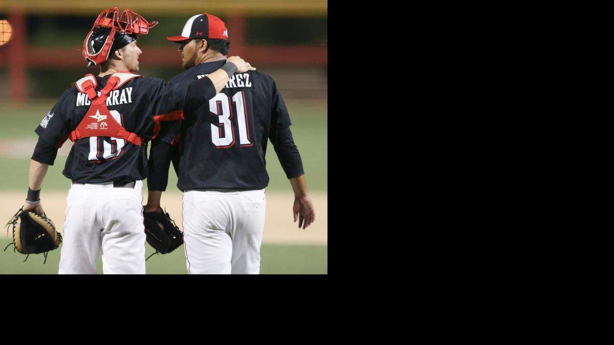 
Wingnuts catcher Chris McMurray, left, congratulates pitcher Matt Nevarez (31) after closing out the game against Sioux Falls at Lawrence-Dumont Stadium on July 9.
