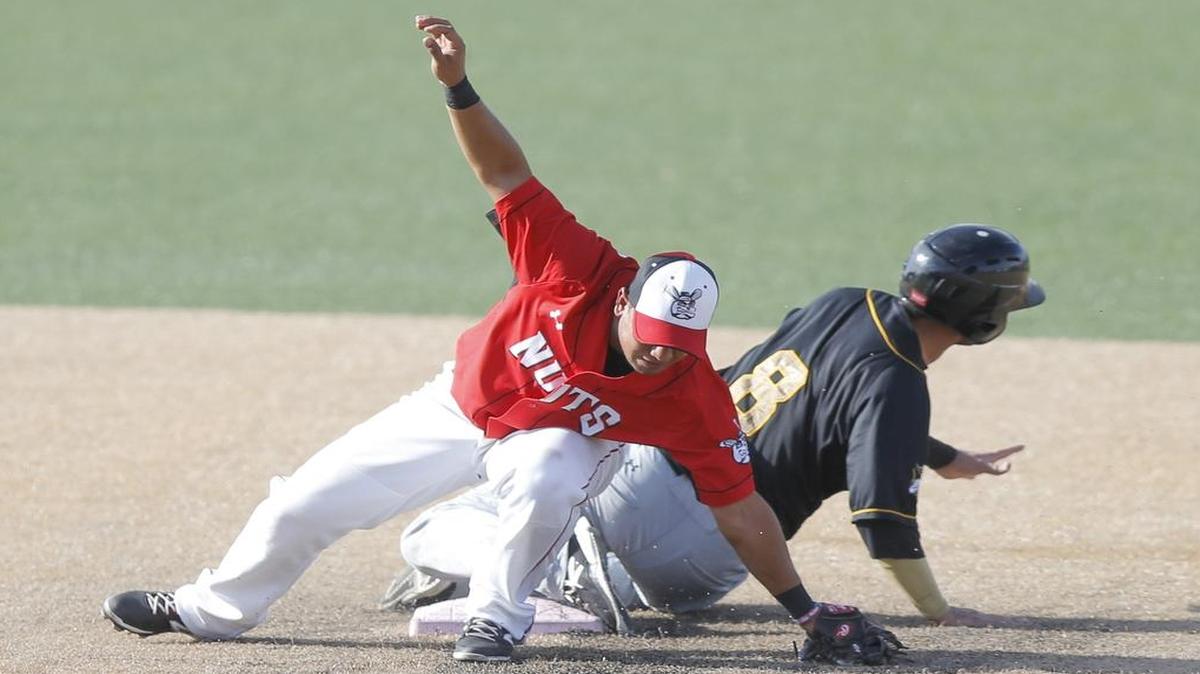 
Wichita's Luis Hernandez can't make a play at second against Joplin's Jake Taylor. Taylor advanced to third, and a bad throw allowed him to score Thursday at Lawrence-Dumont Stadium.
