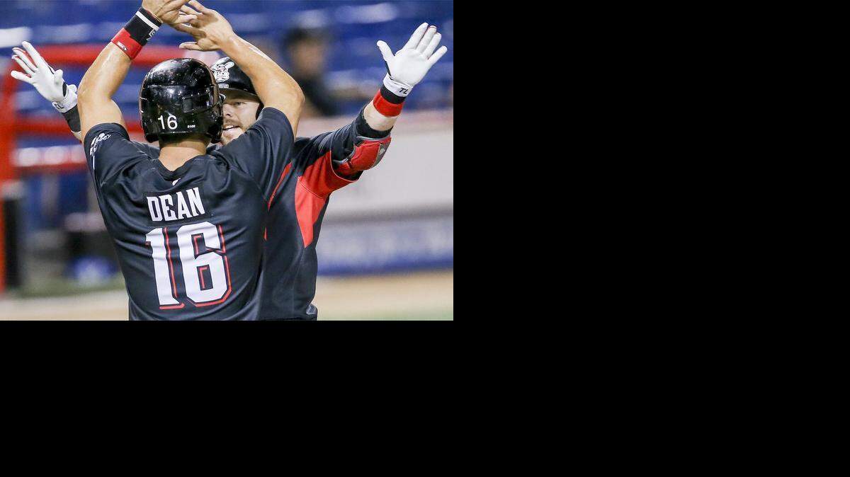 
The Wingnuts' Ryan Khoury is congratulated by catcher Brent Dean after Khoury's three-run homer in the sixth inning at Lawrence-Dumont Stadium on Wednesday. 
