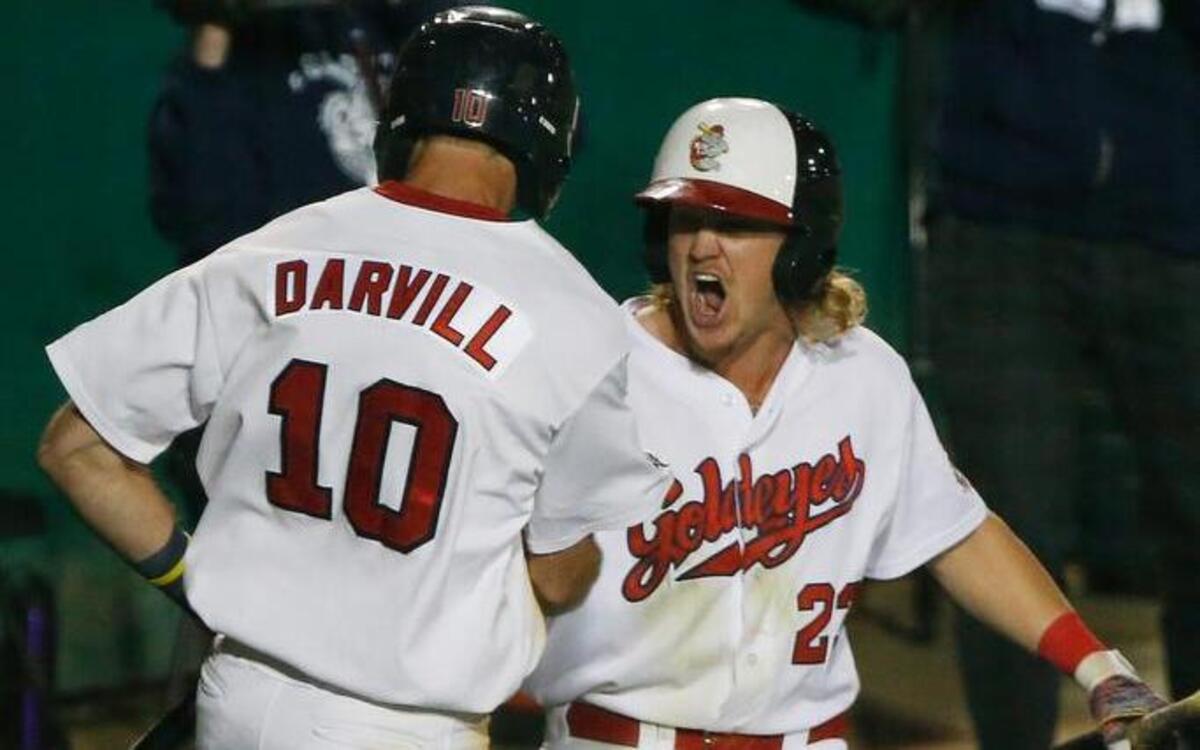 Winnipeg’s Wes Darvill, left, and Josh Romanski celebrate after Darrell scored the tying run in the bottom of the ninth Monday.