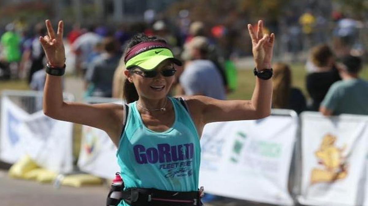 Meg Russell reaches the finish line of 2015 fall half marathon.