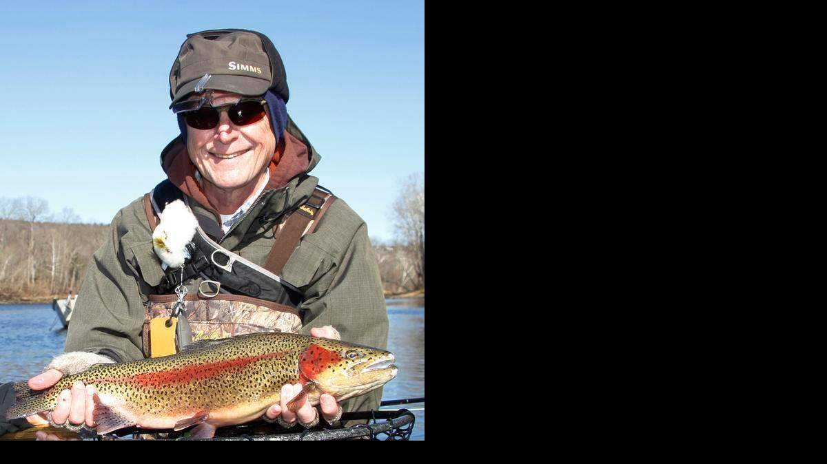 
Norbert Belz and a big rainbow trout he caught fly fishing last week at Lake Taneycomo. 
