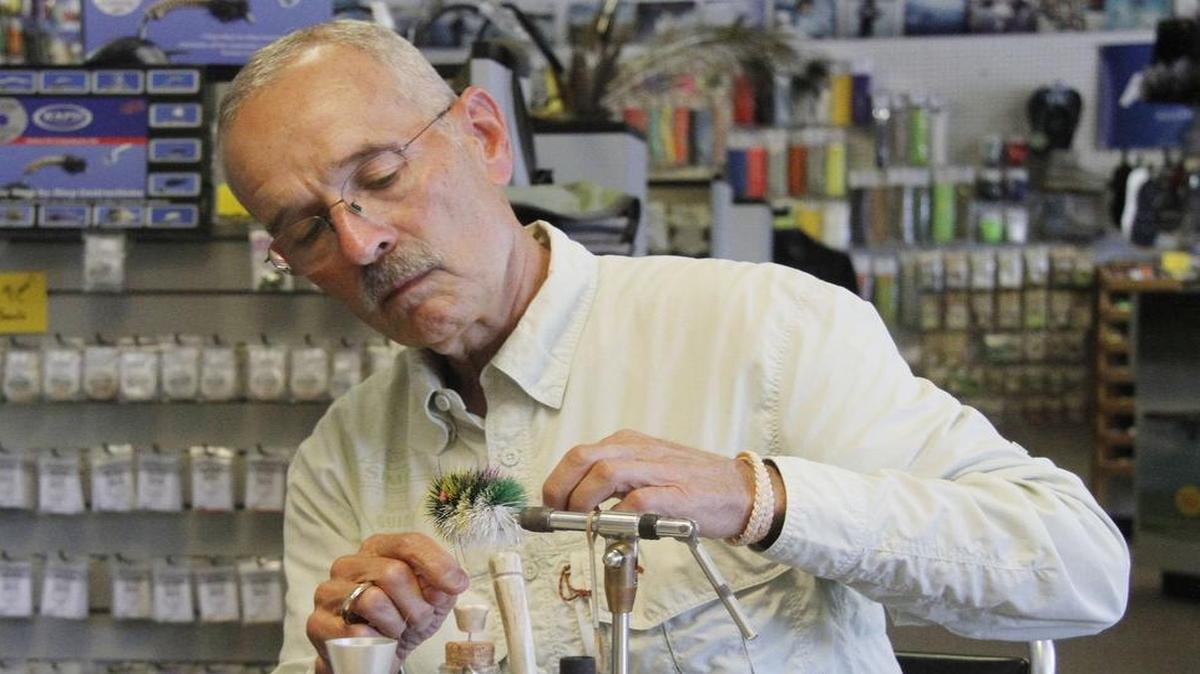 
Master deer hair fly tier Mike George demonstrates how he makes his creations. 
