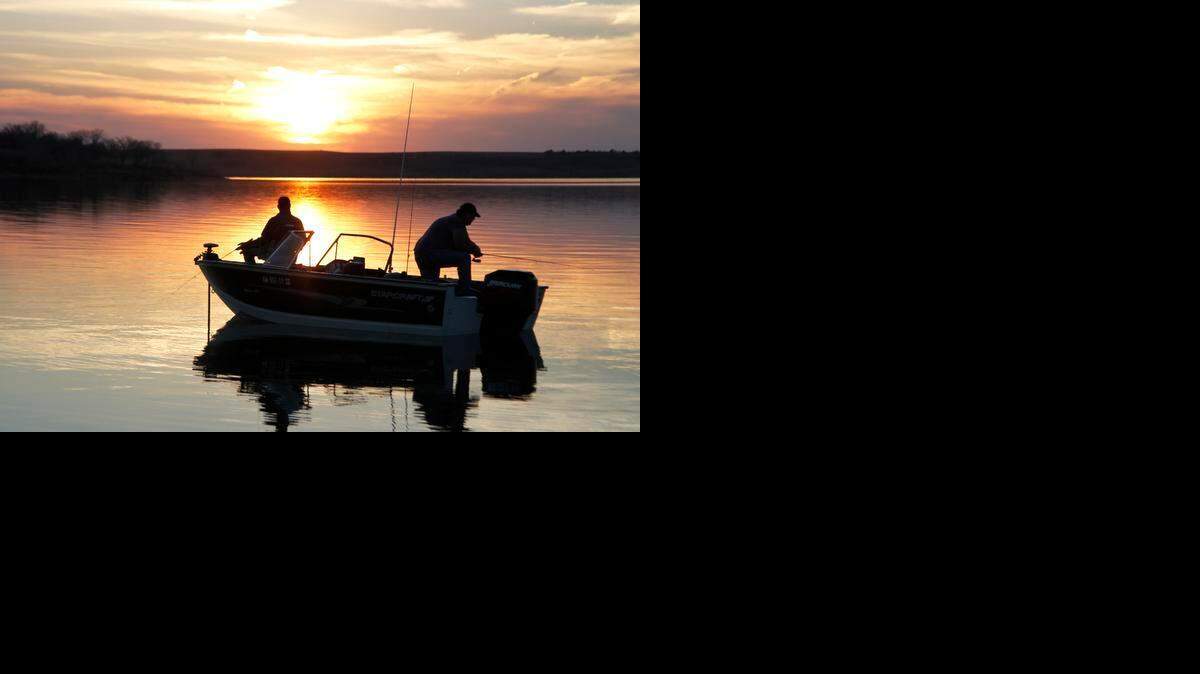
Anglers fish over deep, quiet water at Kanopolis Reservoir. 
