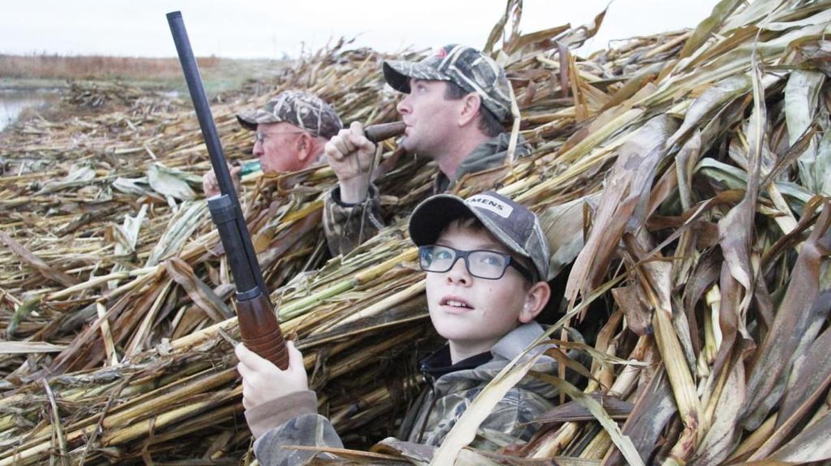 Landen Snyder, watches for ducks as his dad, Russ, center, and grandfather Bob work their calls. The 13-year-old’s birthday coincided with Saturday’s opening of duck season for the late duck zone.