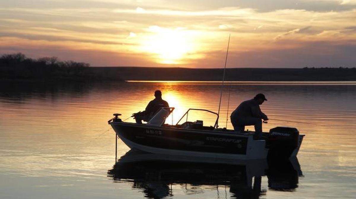 
Anglers fish over deep, quiet water for saugeye Thursday evening at Kanopolis Reservoir. Fishing has been good at the lake since the ice left last weekend.
