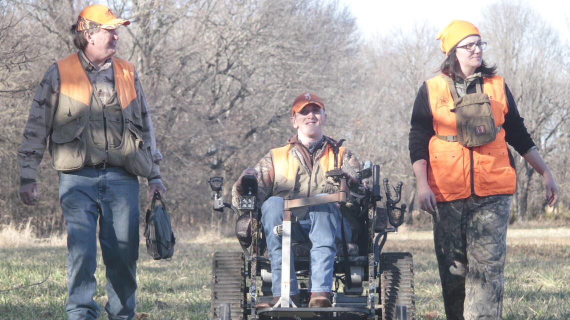 New tank-like chairs help disabled Kansas hunters roll through the mud in pursuit of game