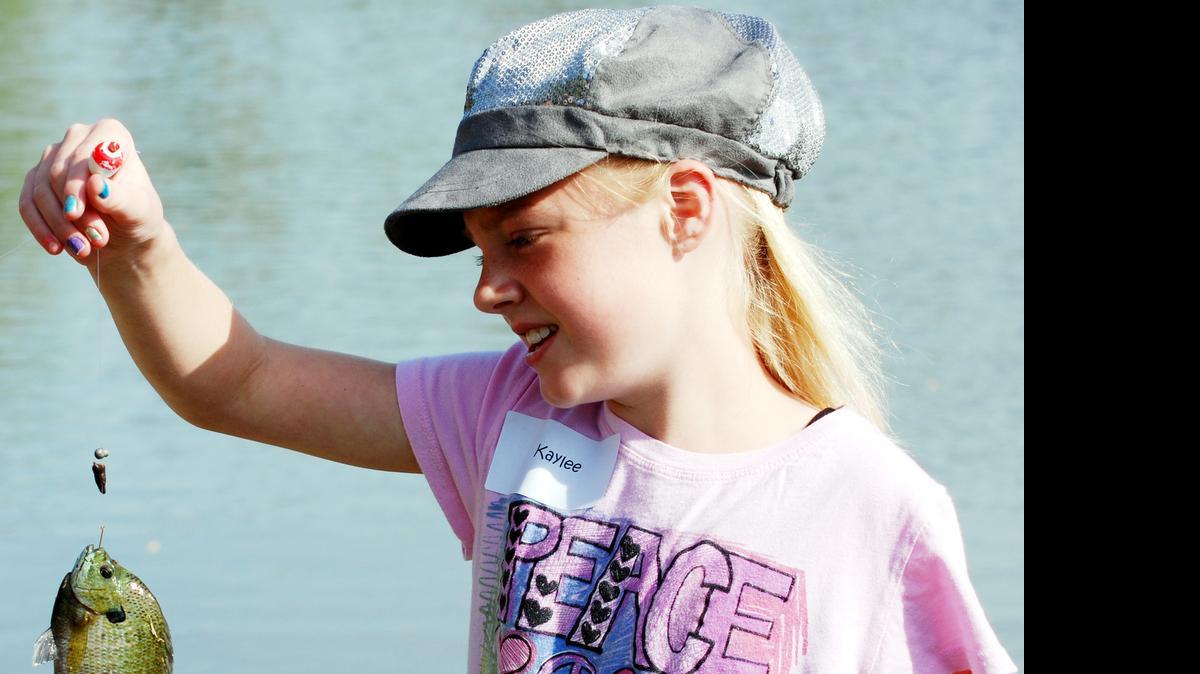 
Targeting small fish, like this bluegill, can be the quickest way to put a big smile on a young angler’s face. Both bluegill and green sunfish are common in most Wichita area waters in high numbers. 
