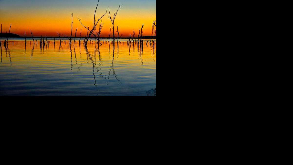 
ADULT FIRST PLACE. Sunrise at Clinton Lake: Mike Scheufler was returning home from Kansas City and decided to stop at Clinton Reservoir to photograph a sunrise.
