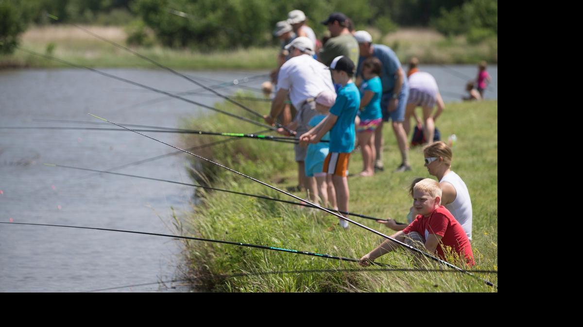
Kids take part in the Wichita Eagle's Kids Fishing Clinic in 2014 at Chisholm Creek Park.

