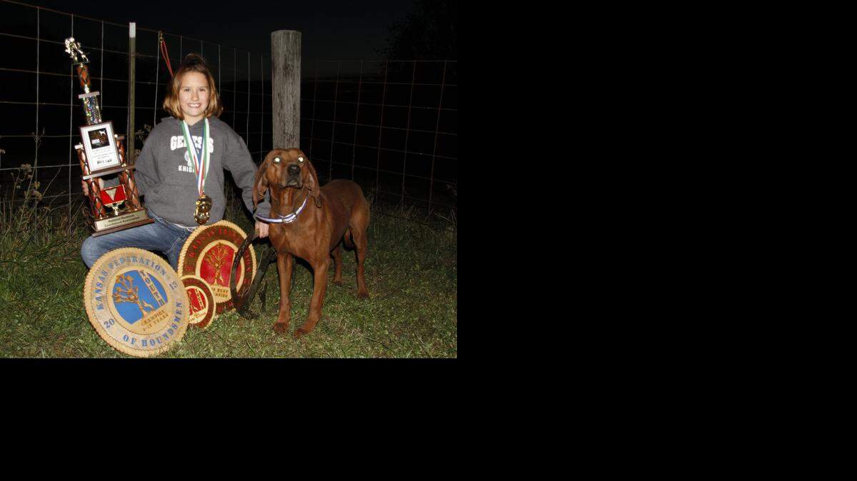 
Ten-year-old Taylor Lux and her redbone hound, Ranger, have won several state and national raccoon hunting awards.
