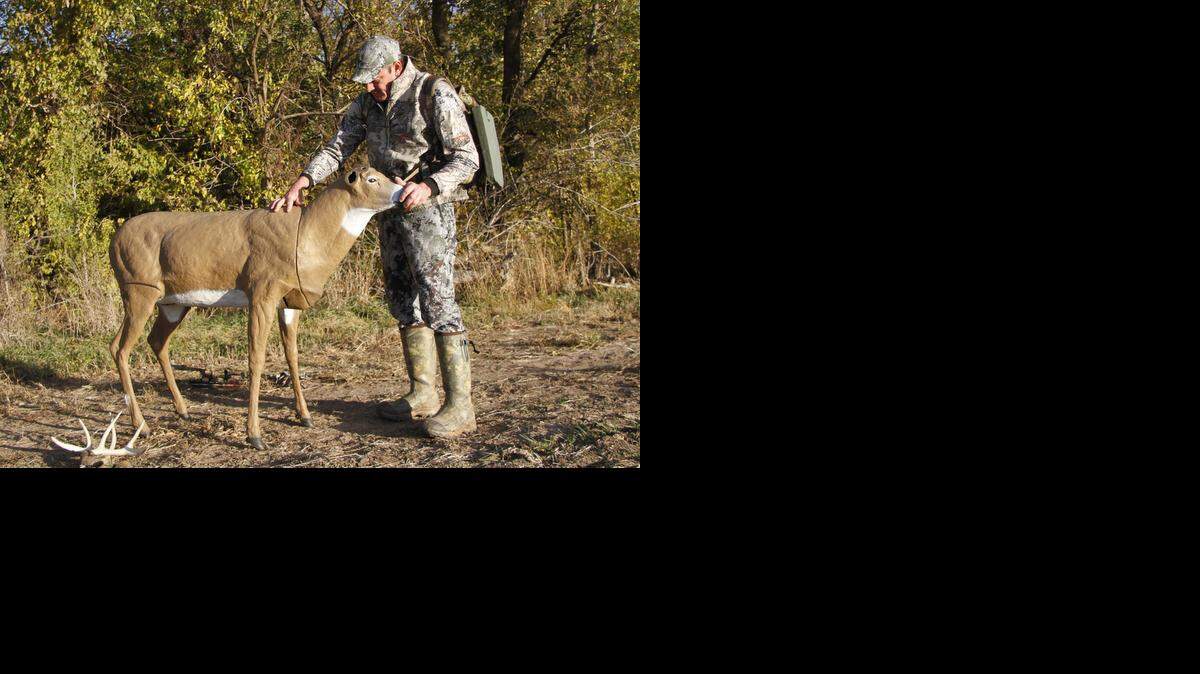 
Kyle Adams assembles his buck decoy, which packs into its body for easier transportation.
