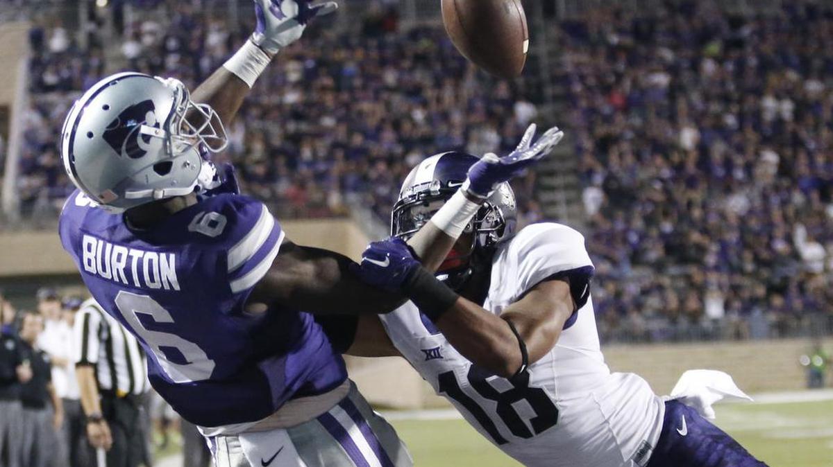 
TCU safety Nick Orr (18) knocks away pass intended for K-State wide receiver Deante Burton (6) in the end zone Saturday in the 2nd quarter. (October 10, 2015) 
