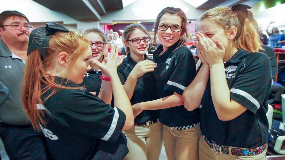 The Campus girls bowling team celebrates after winning its second consecutive Class 6A championship Thursday at Northrock Lanes.
