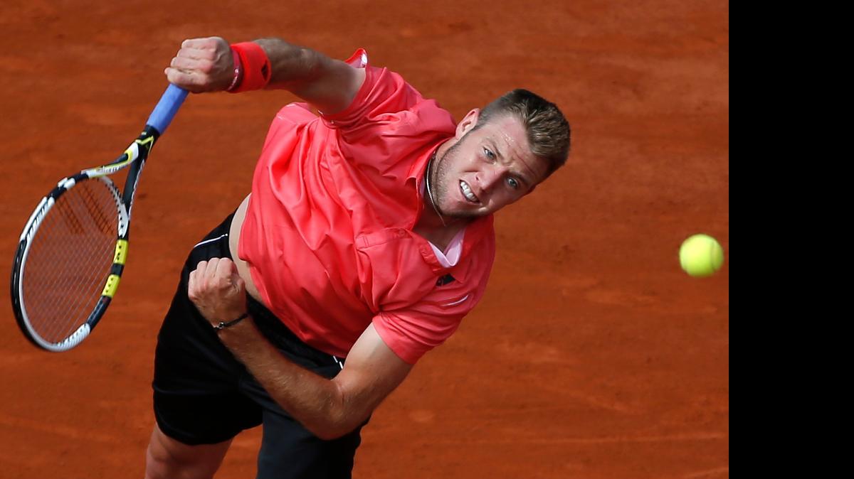 
Jack Sock serves in Monday’s fourth-round match of the French Open against Spain's Rafael Nadal at Roland Garros Stadium in Paris.
