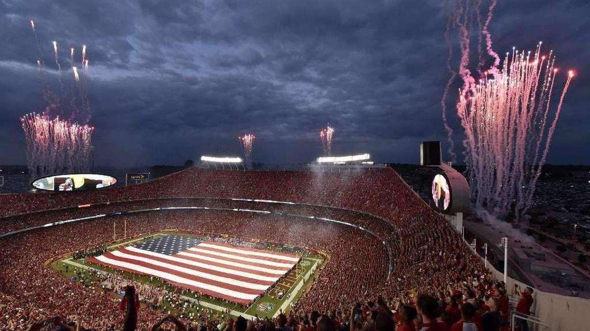 
Fireworks lit the sky and fans cheered as a full-field American Flag was unfurled during pregame ceremonies Thursday at Arrowhead Stadium.
