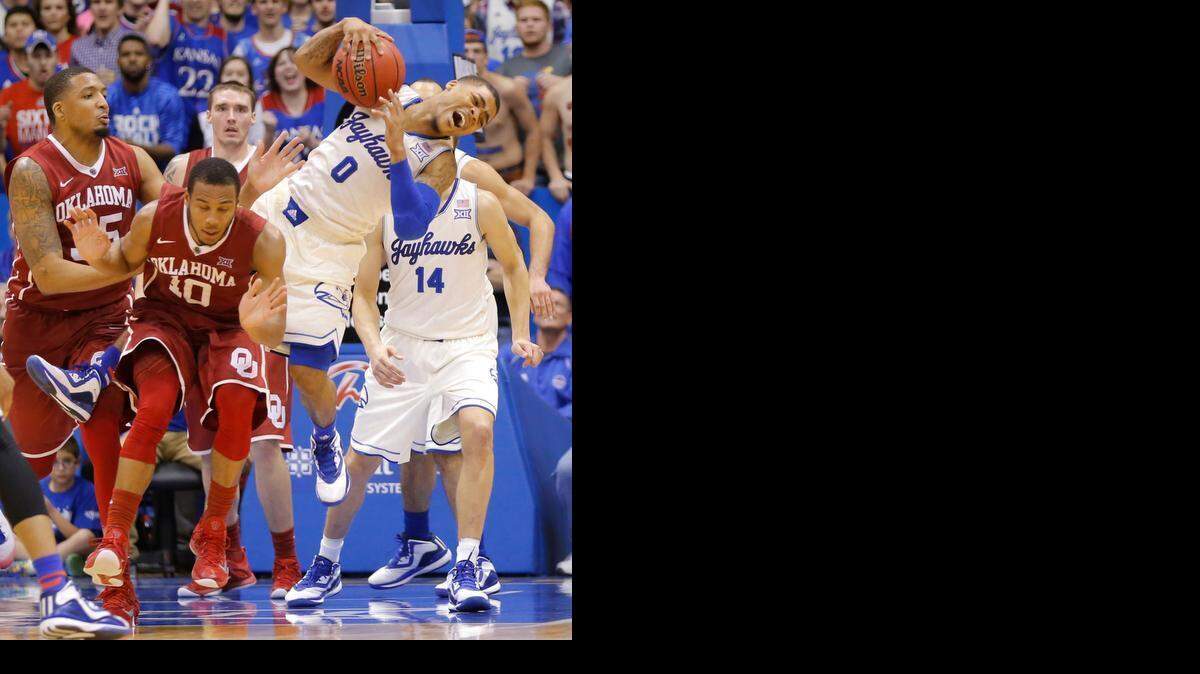 
Kansas guard Frank Mason III collides with Oklahoma guard Jordan Woodard while fight for a rebound during the first half on Monday night at Allen Fieldhouse.
