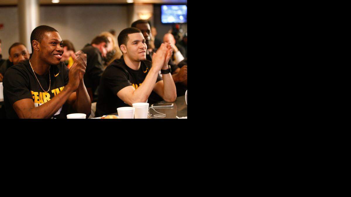
Wichita State University basketball players Cleanthony Early, left, and Fred VanVleet clap after it was announced that WSU was a No. 1 seed in the NCAA Tournament in March.
