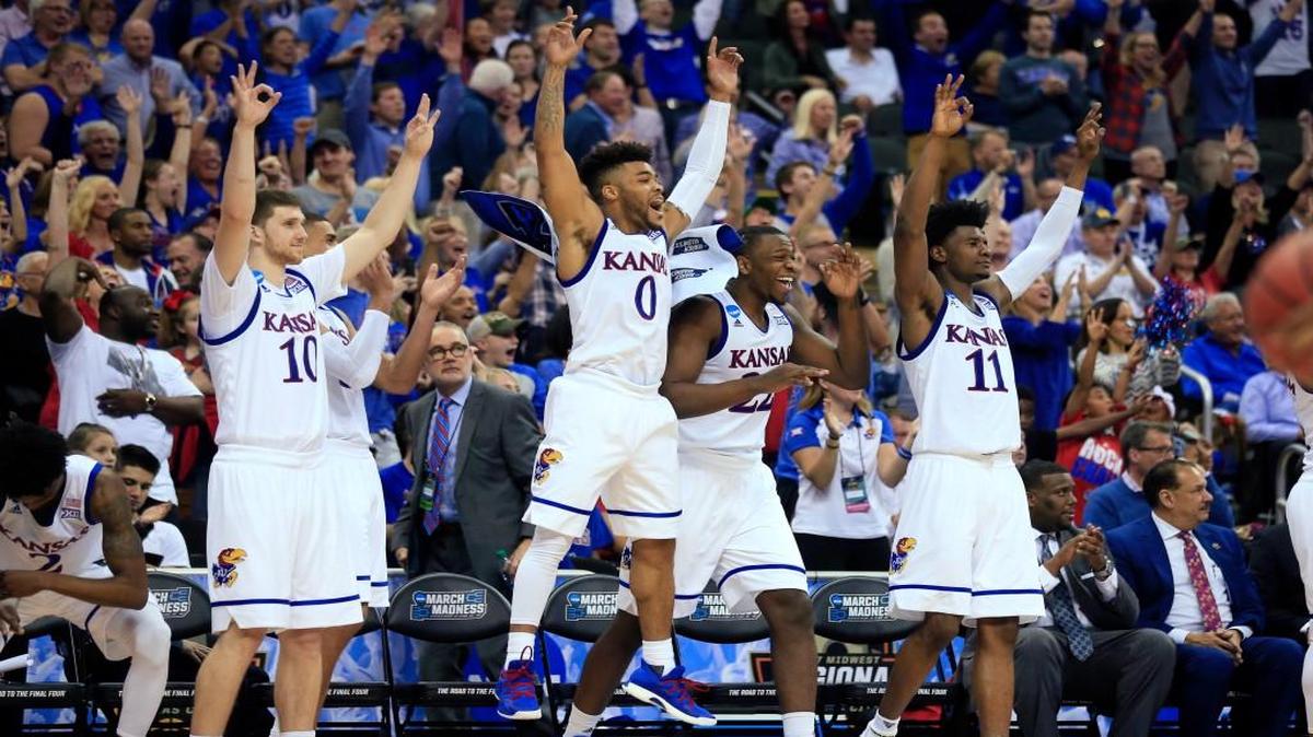 Kansas guard Frank Mason III (0) celebrates with teammates at the end of a regional semifinal against Purdue on Thursday in Kansas City, Mo.