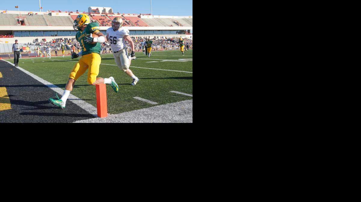 
Carroll's Denzel Goolsby scores a touchdown in front of St. Thomas Aquinas’ Ryan Rysavy during the Class 5A title game in Pittsburg on Nov. 30.
