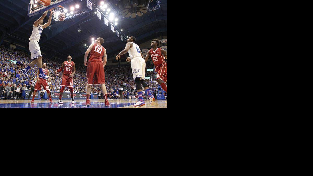 Kansas forward Perry Ellis dunks the ball over Oklahoma forward Ryan Spangler on Tuesday night at Allen Fieldhouse.
