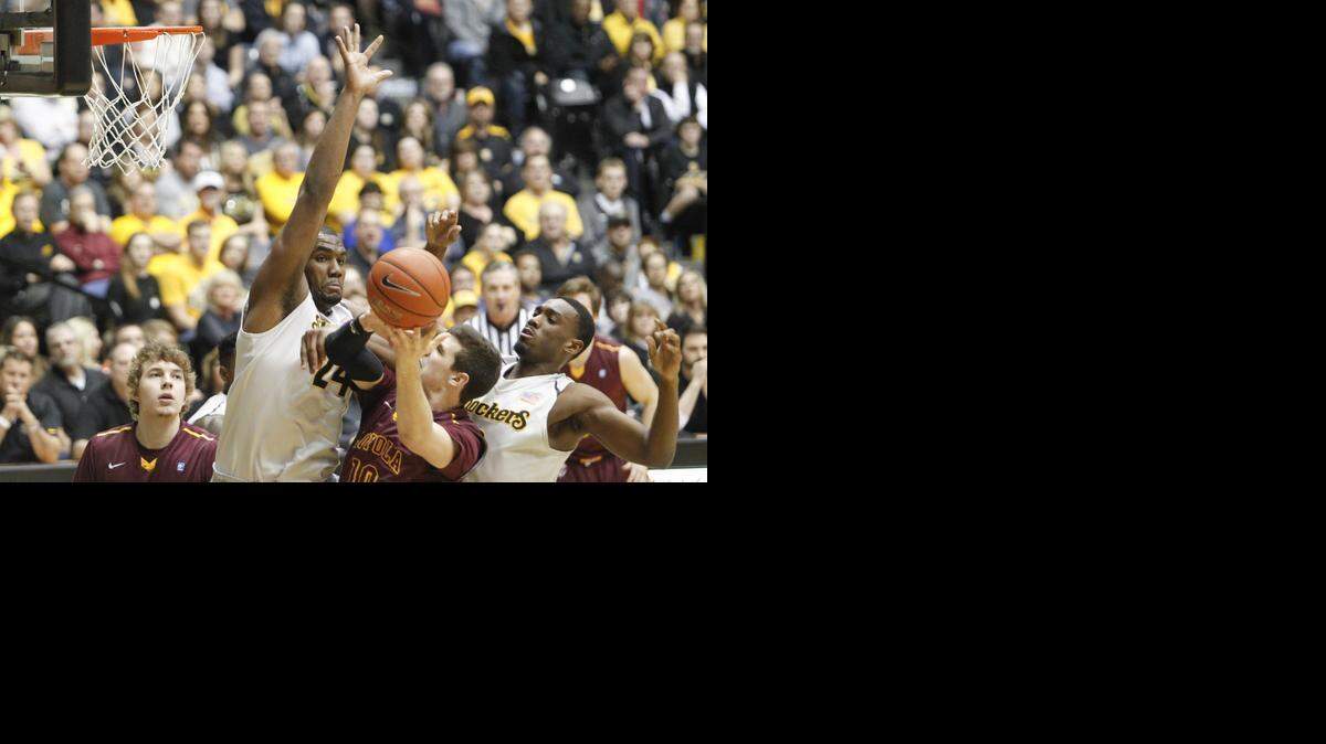 
Wichita State forward Shaquille Morris defends Loyola forward Jay Knuth during the second half on Wednesday night at Koch Arena. (Jan. 28, 2015) 
