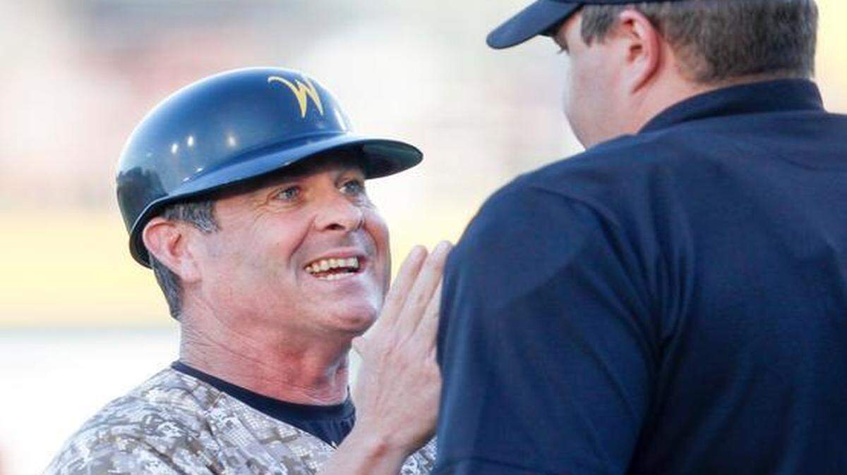 
Wichita State coach Todd Butler argues with an umpire during a game against Kansas on April 1. The Shockers have struggled to win games this season, but Butler says he can see improvement.
