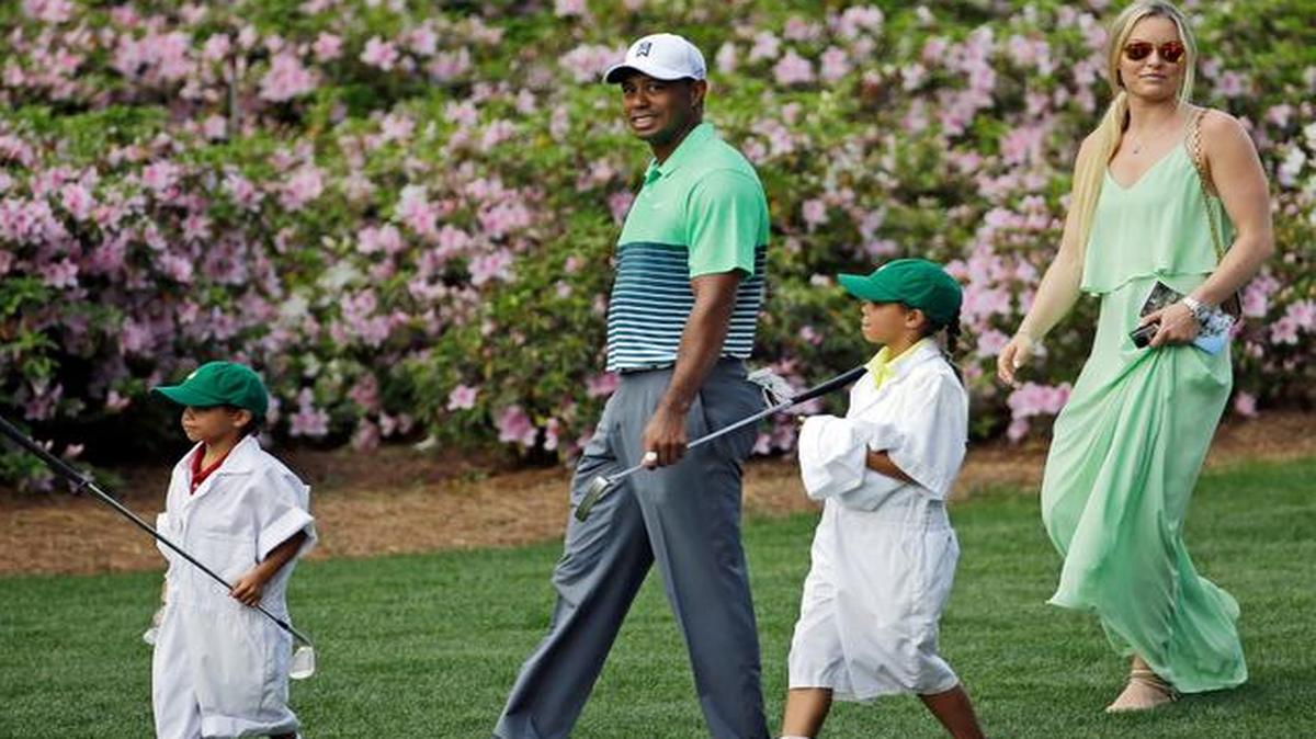 
Tiger Woods walks with his children Charlie and Sam, and Lindsey Vonn during the Par 3 contest Wednesday at the Masters in Augusta, Ga.
