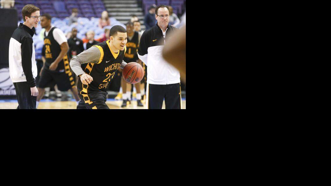 
Kellen Marshall, left, and his father, WSU coach Gregg Marshall, watch Fred VanVleet during an NCAA workout last season. Kellen Marshall was just 10 when he came with his family to Wichita in 2007.
