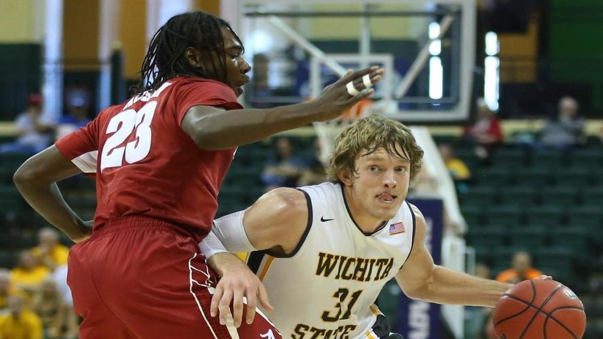 Wichita State guard Ron Baker drives against Alabama guard Brandon Austin on Friday. WSU coach Gregg Marshall thinks defenders have been physical with Baker beyond the crackdown by officials on contact.