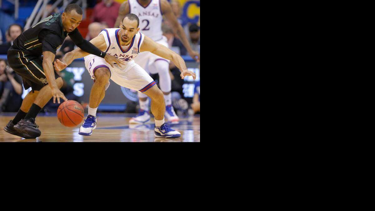 
Kansas forward Perry Ellis tries to steal the ball from Baylor guard Lester Medford during the second half. Ellis had another Ellis game – 18 points on 7-of-11 shooting with six rebounds.
