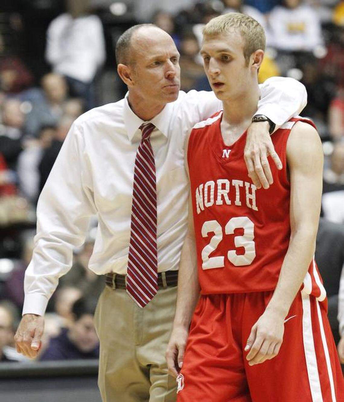 Conner Frankamp, right, played on the Koch Arena court in the Class 6A tournament with Marty Frankamp, his father, as a North High assistant.