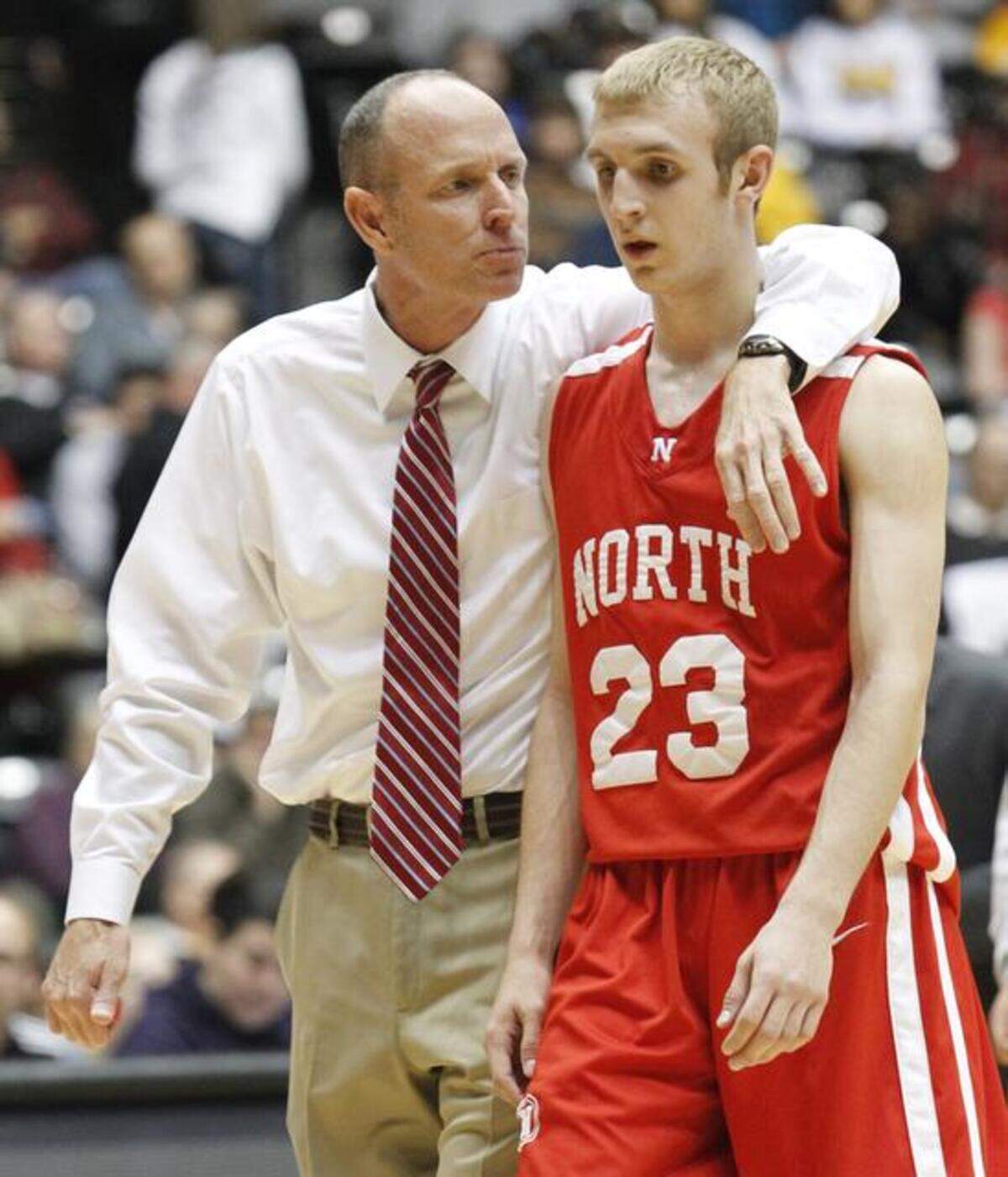 Conner Frankamp, right, played on the Koch Arena court in the Class 6A tournament with Marty Frankamp, his father, as a North High assistant.