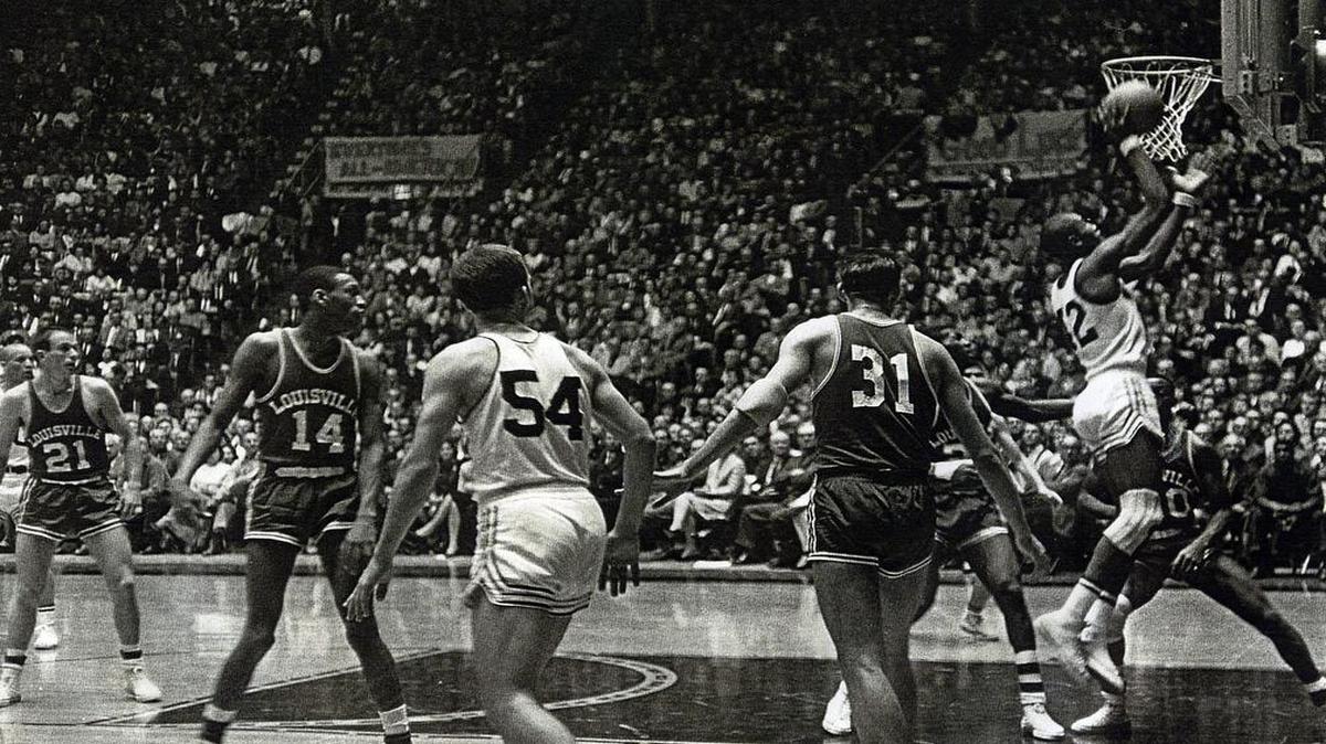 Dave Stallworth puts in a layup during is final Shocker game on Jan. 30, 1965, against Louisville. Stallworth’s eligibility expired before the season’s second semester began. A sign hanging in the background says, “Everybody’s All-American.”
