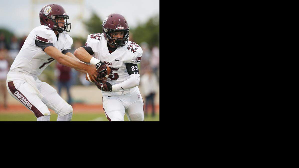
Buhler’s Jace Williams, left, has proven to be a standout quarterback as a junior.
