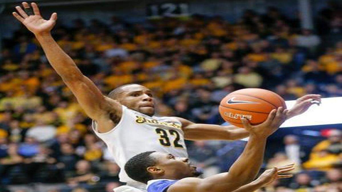 
Wichita State's Tekele Cotton gets ready to block a shot by Indiana State's Tre’ Bennett in early February at Koch Arena.
