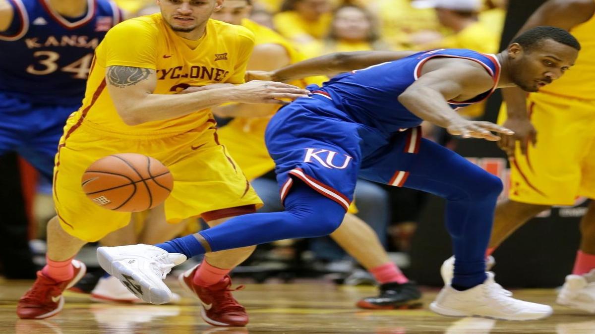 Iowa State forward Abdel Nader, left, steals the ball from Kansas guard Wayne Selden during Monday’s second half.